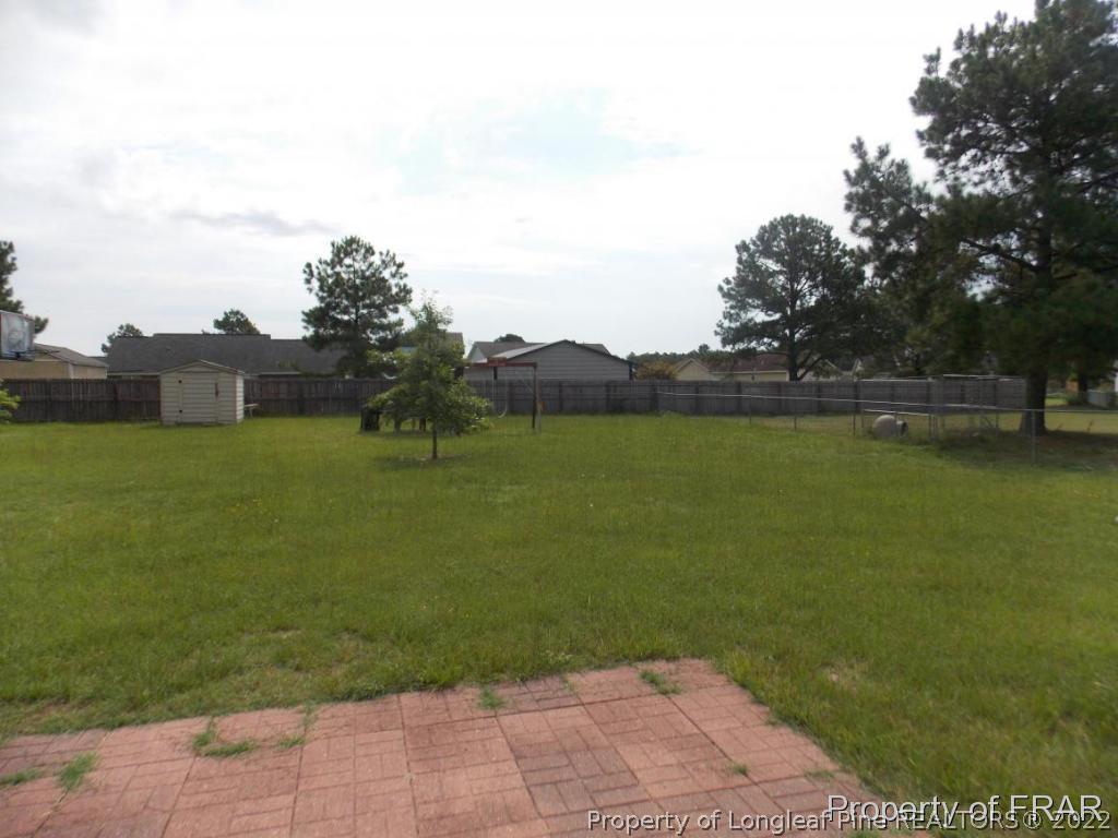 10071 Rockfish Road Raeford, NC 28376 - Photo 13 of 15 a view of a lake with houses in the background