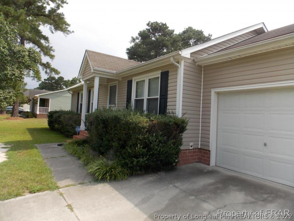 10071 Rockfish Road Raeford, NC 28376 - Photo 2 of 15 a front view of a house with garden