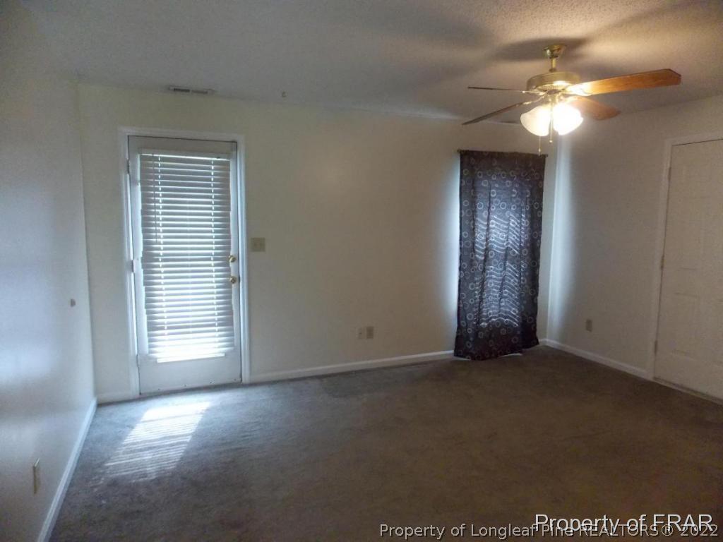 10071 Rockfish Road Raeford, NC 28376 - Photo 3 of 15 a view of empty room with window