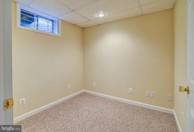 a view of a house with a sink and a yard with wooden fence