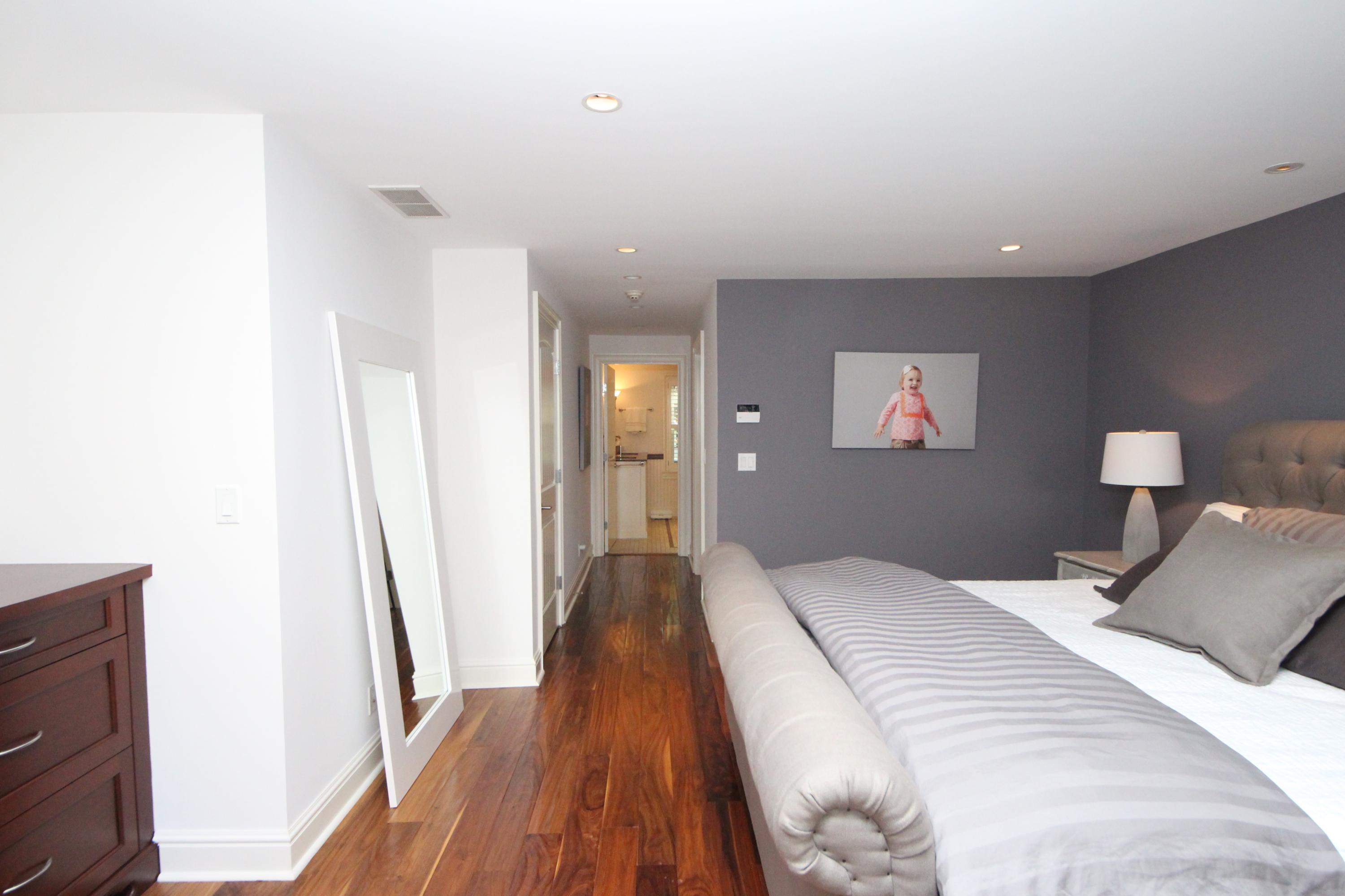 33 Intervale Road Darien, CT 06820 - Photo 12 of 28 a bedroom with a bed and a mirror