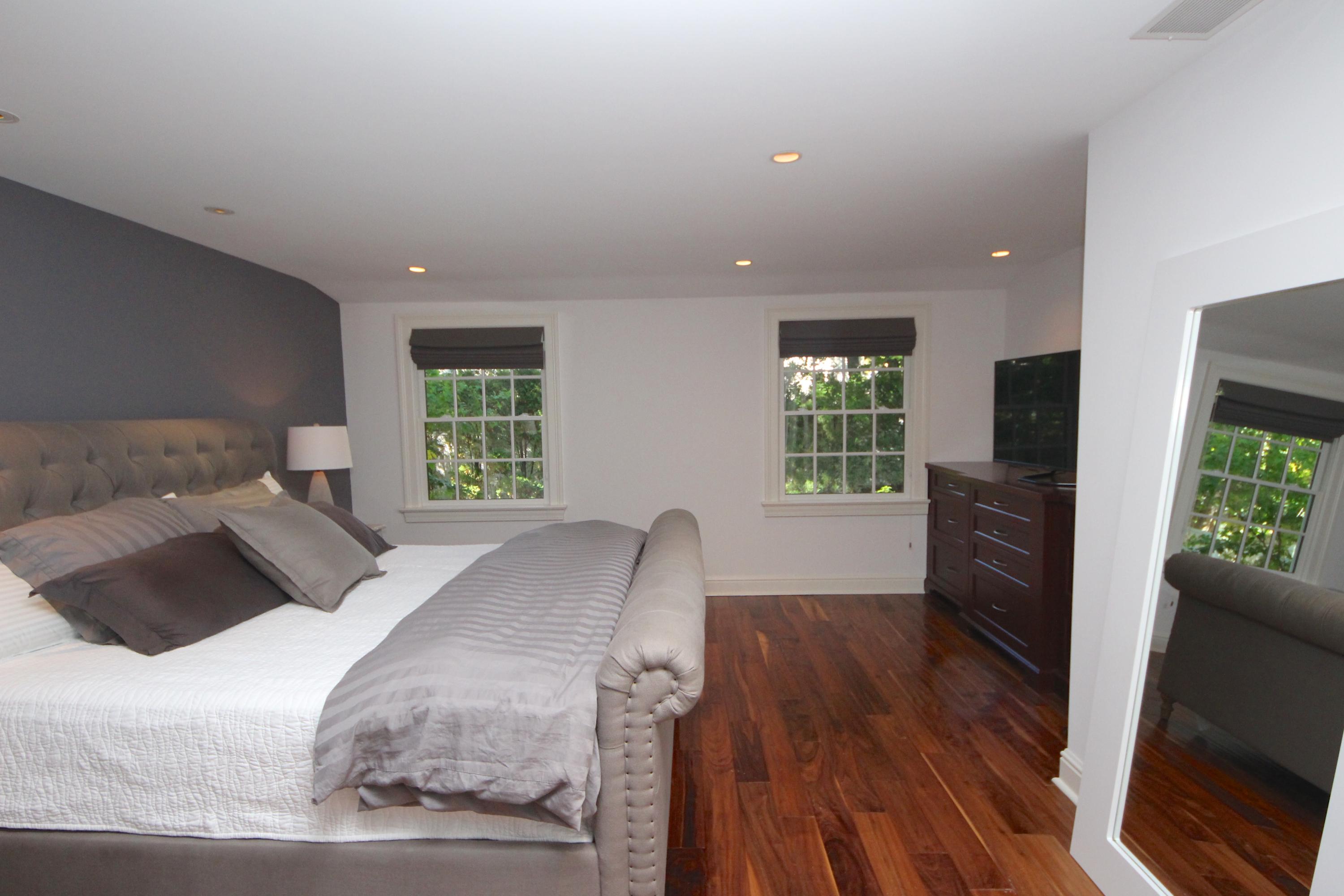 33 Intervale Road Darien, CT 06820 - Photo 13 of 28 a bedroom with a bed and a television