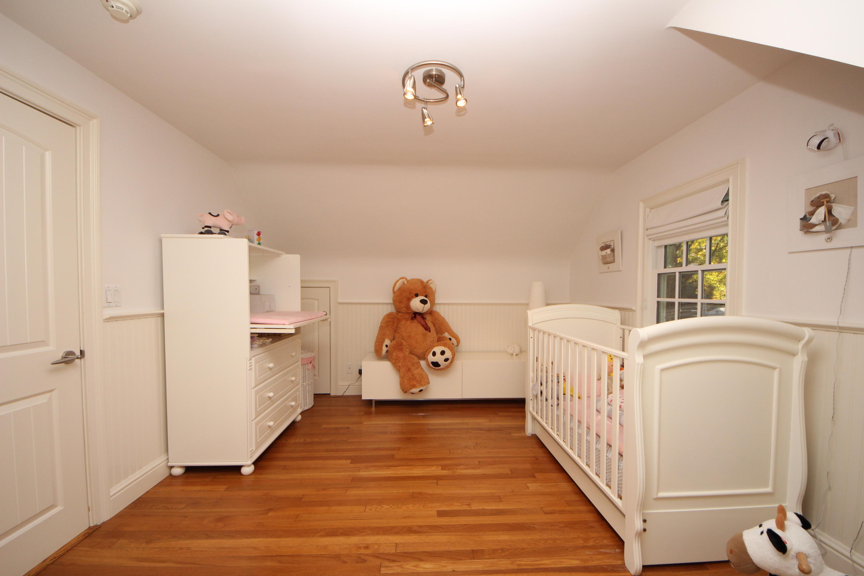 33 Intervale Road Darien, CT 06820 - Photo 18 of 28 a bedroom with furniture and wooden floor