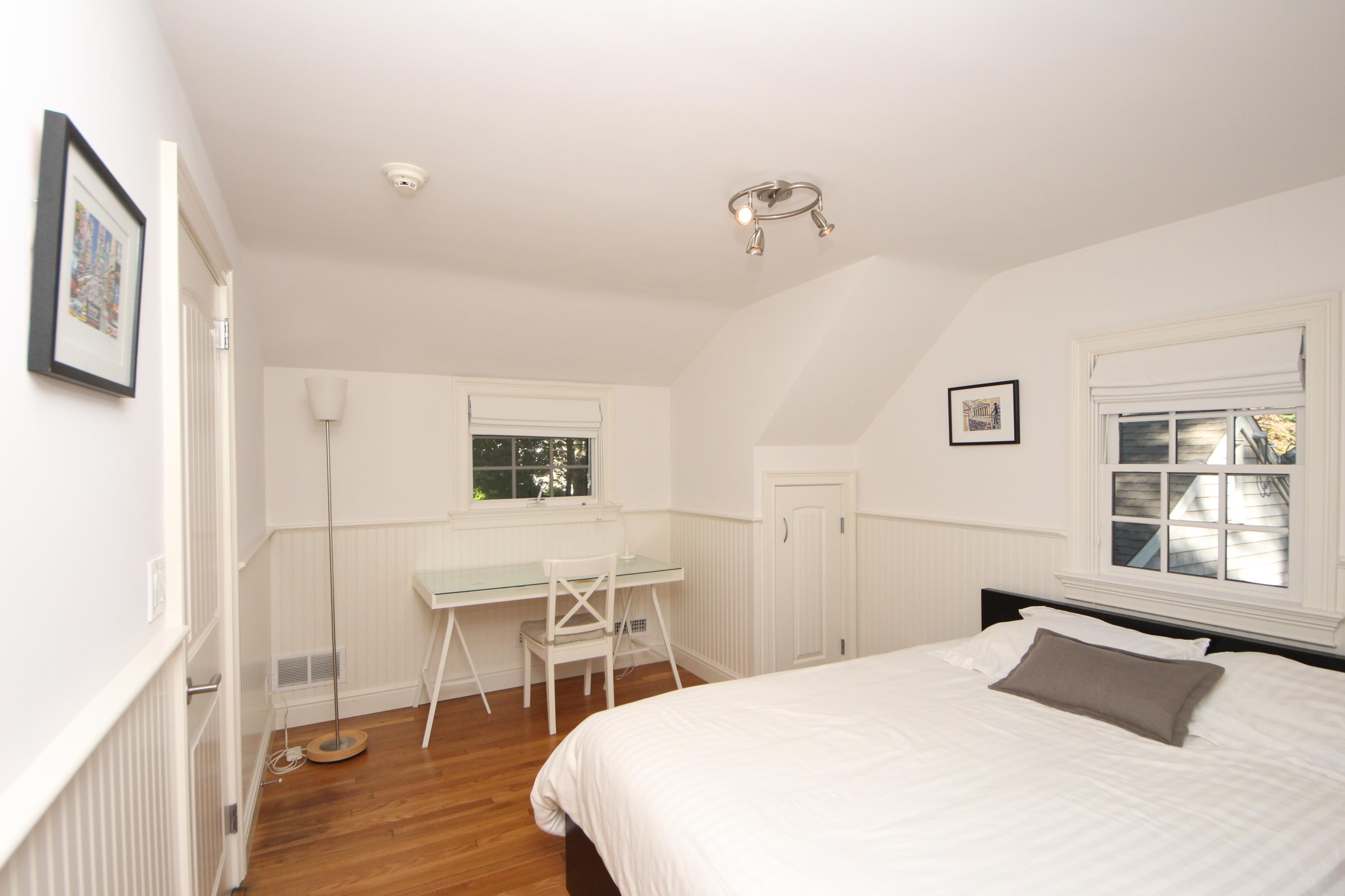 33 Intervale Road Darien, CT 06820 - Photo 21 of 28 a bedroom with a bed and a table in it