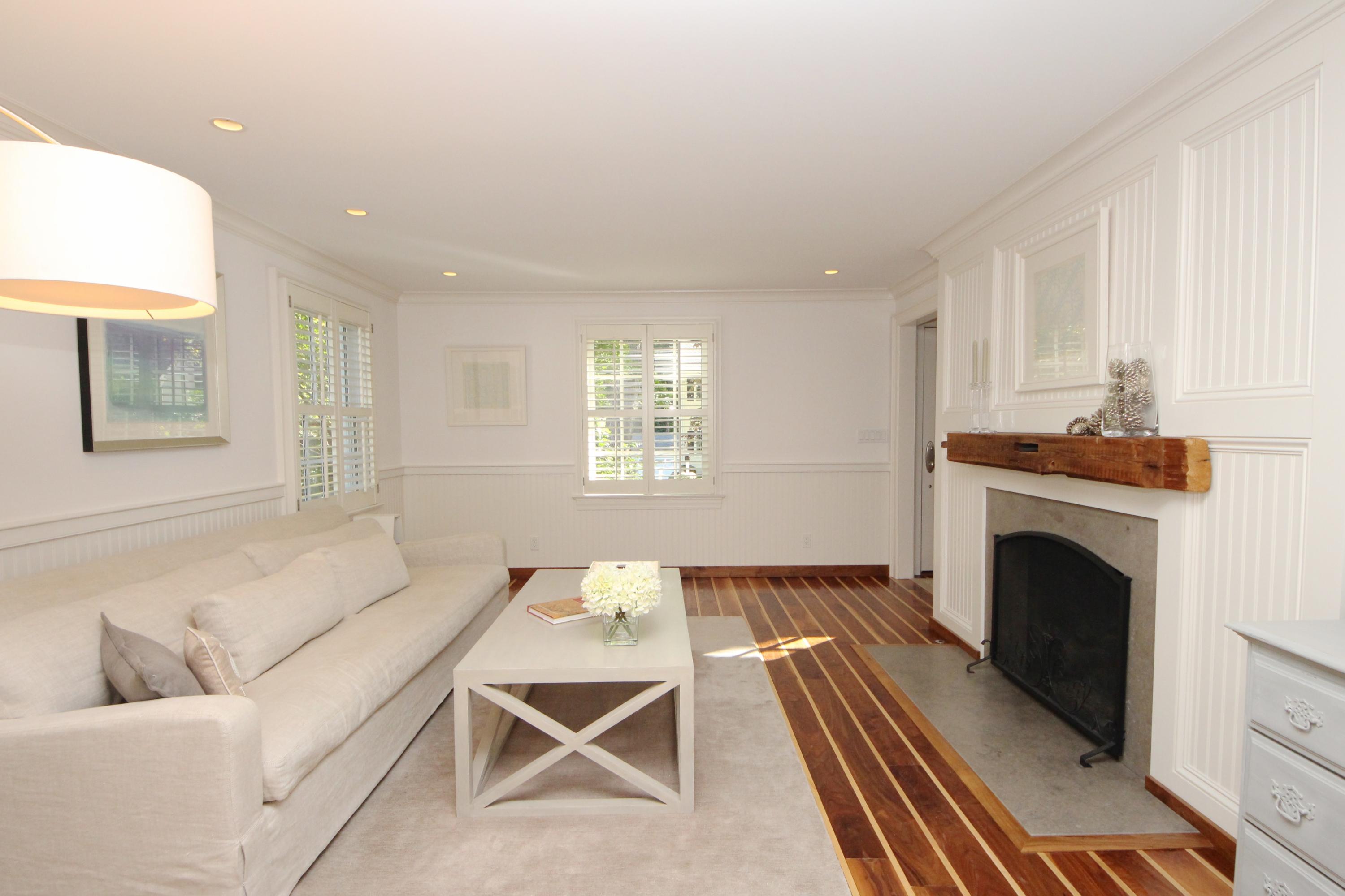 33 Intervale Road Darien, CT 06820 - Photo 4 of 28 a living room with furniture a fireplace and a table