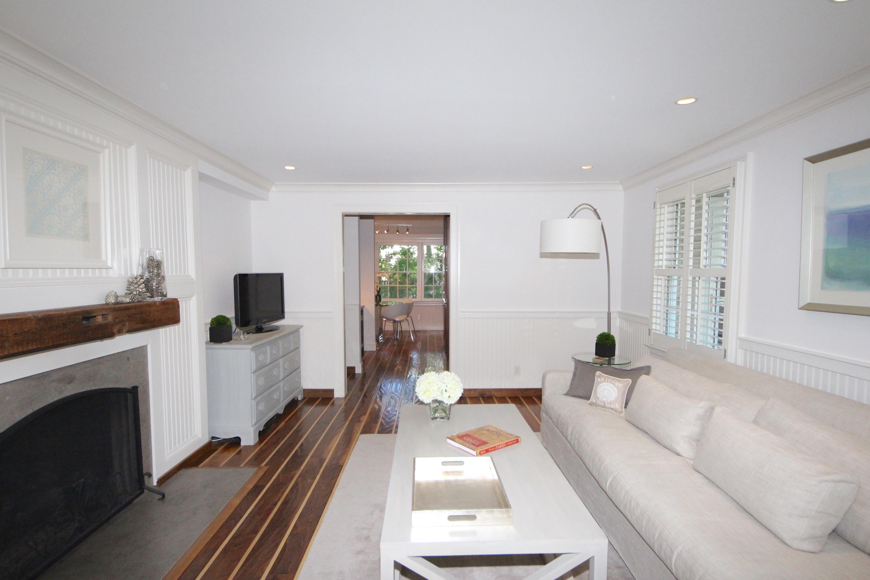 33 Intervale Road Darien, CT 06820 - Photo 5 of 28 a living room with furniture a fireplace and a flat screen tv