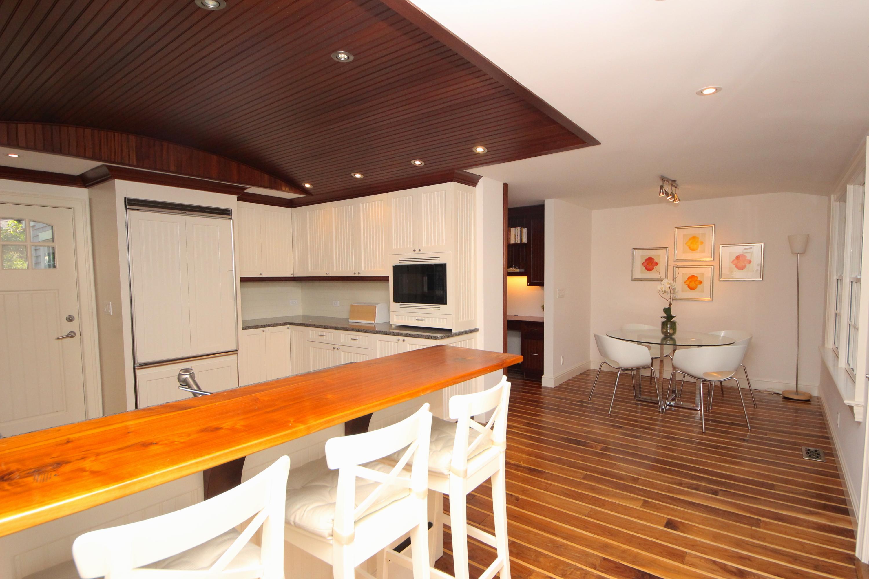 33 Intervale Road Darien, CT 06820 - Photo 28 of 28 a room with wooden floor table and chairs