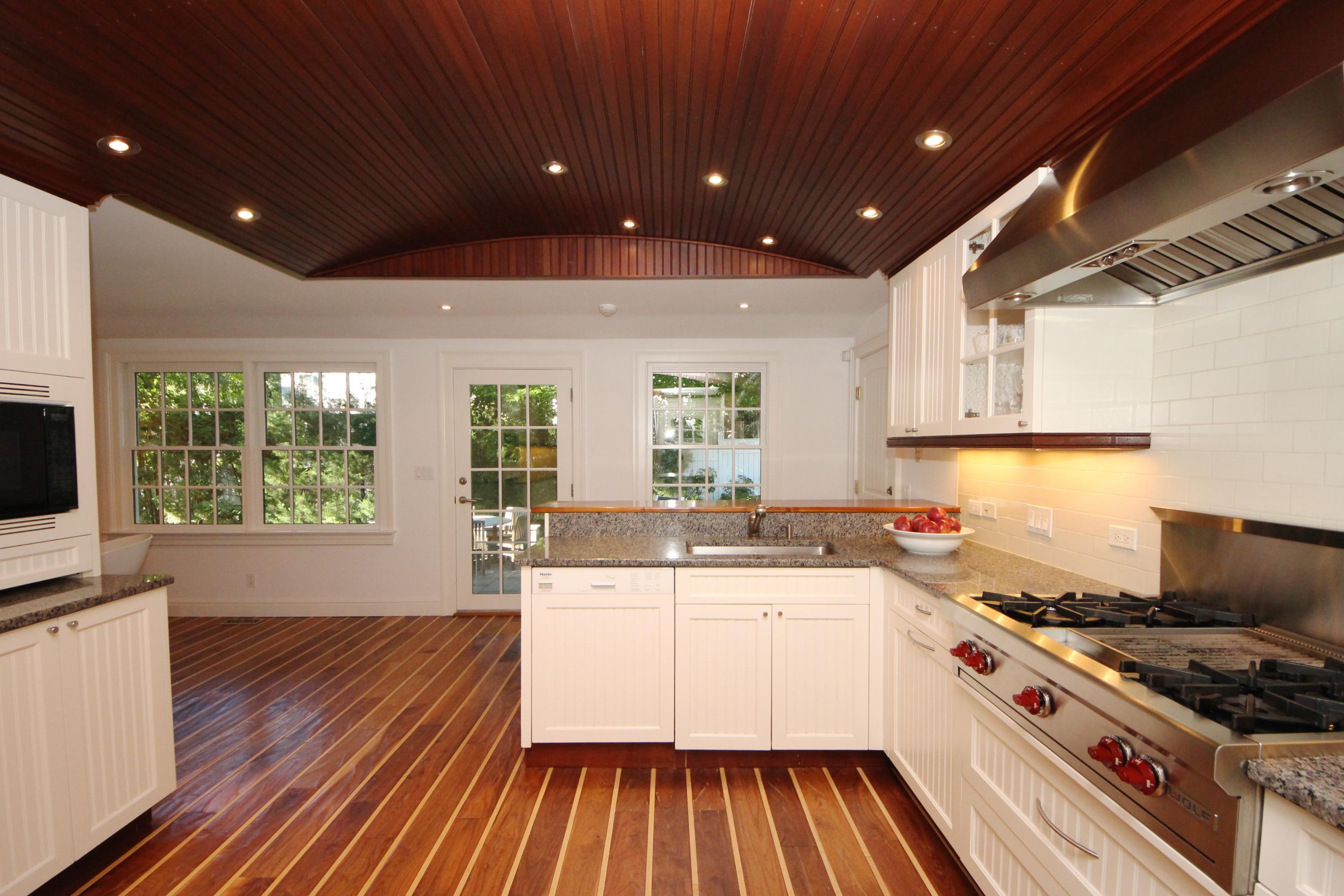 33 Intervale Road Darien, CT 06820 - Photo 7 of 28 a kitchen with a sink stove and cabinets