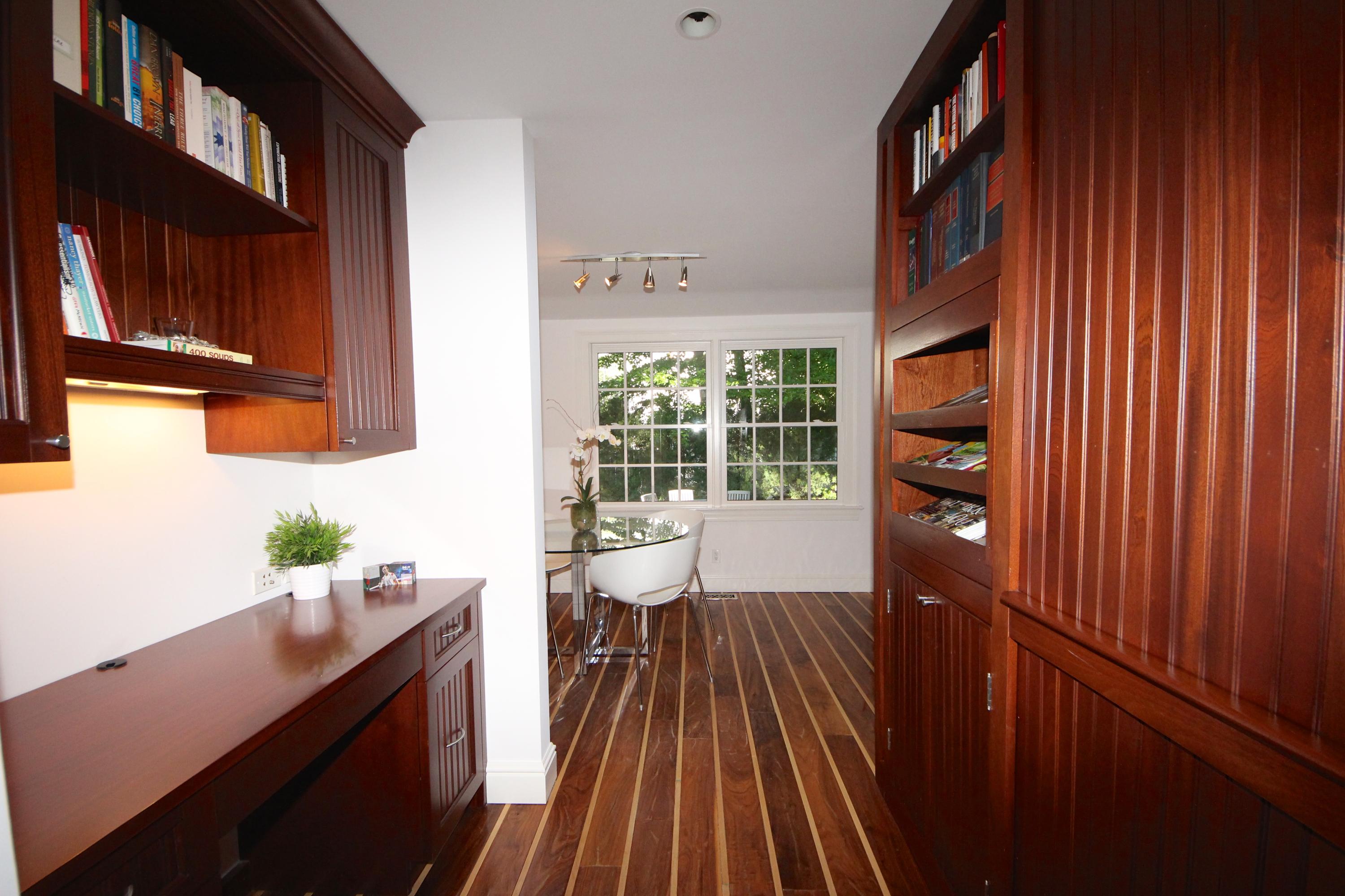 33 Intervale Road Darien, CT 06820 - Photo 8 of 28 a view of a hallway with wooden floor and furniture