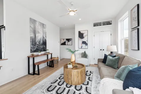 a living room with furniture and a table