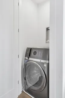 a utility room with washing machine