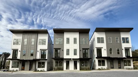 a front view of a building with a lots of windows