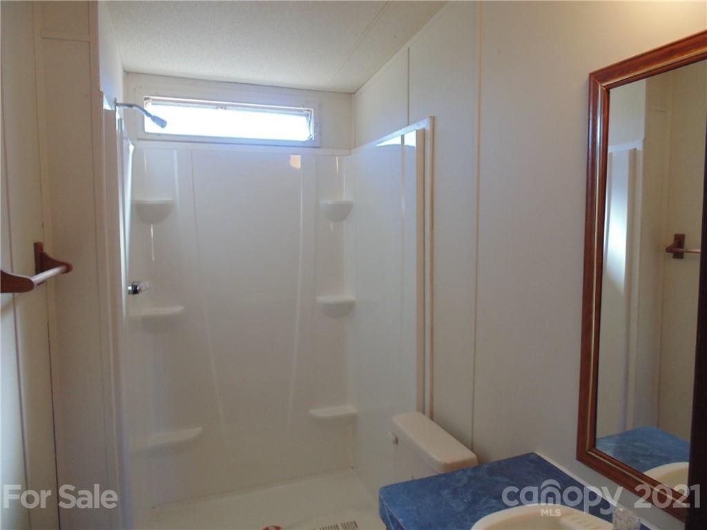 4335 Willis Hollis Road Edgemoor, SC 29712 - Photo 11 of 26 a bathroom with a shower