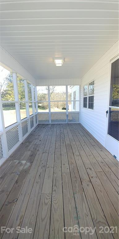 4335 Willis Hollis Road Edgemoor, SC 29712 - Photo 14 of 26 wooden floor in an empty room with a window