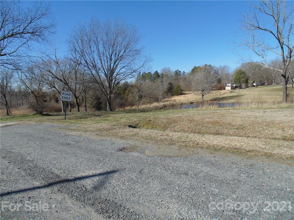 4335 Willis Hollis Road Edgemoor, SC 29712 - Photo 25 of 26 a view of dirt field with large trees