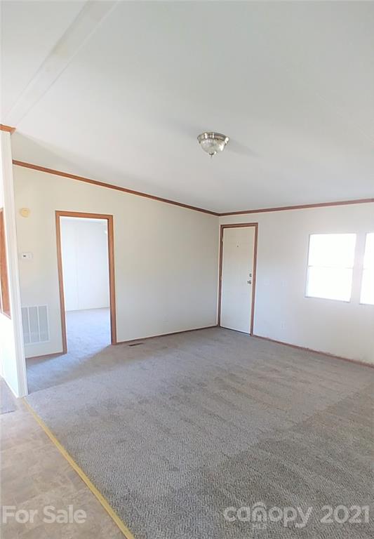 4335 Willis Hollis Road Edgemoor, SC 29712 - Photo 6 of 26 an empty room with windows