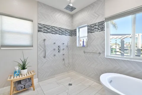 a bathroom with a bathtub and shower