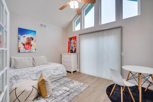 a bedroom with a bed and a window