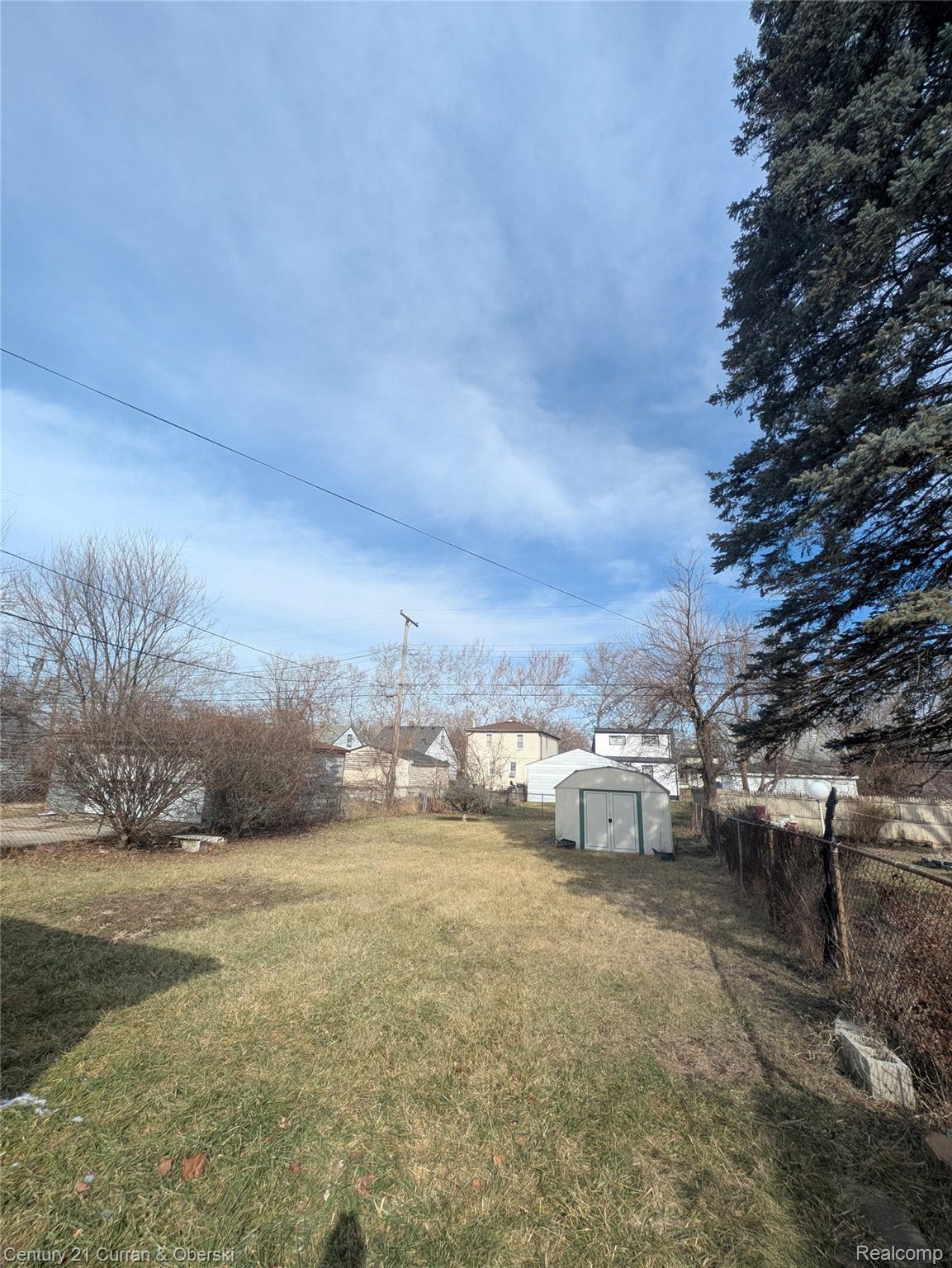 26872 Colgate Street Inkster, MI 48141 - Photo 9 of 9 Fenced backyard with a shed