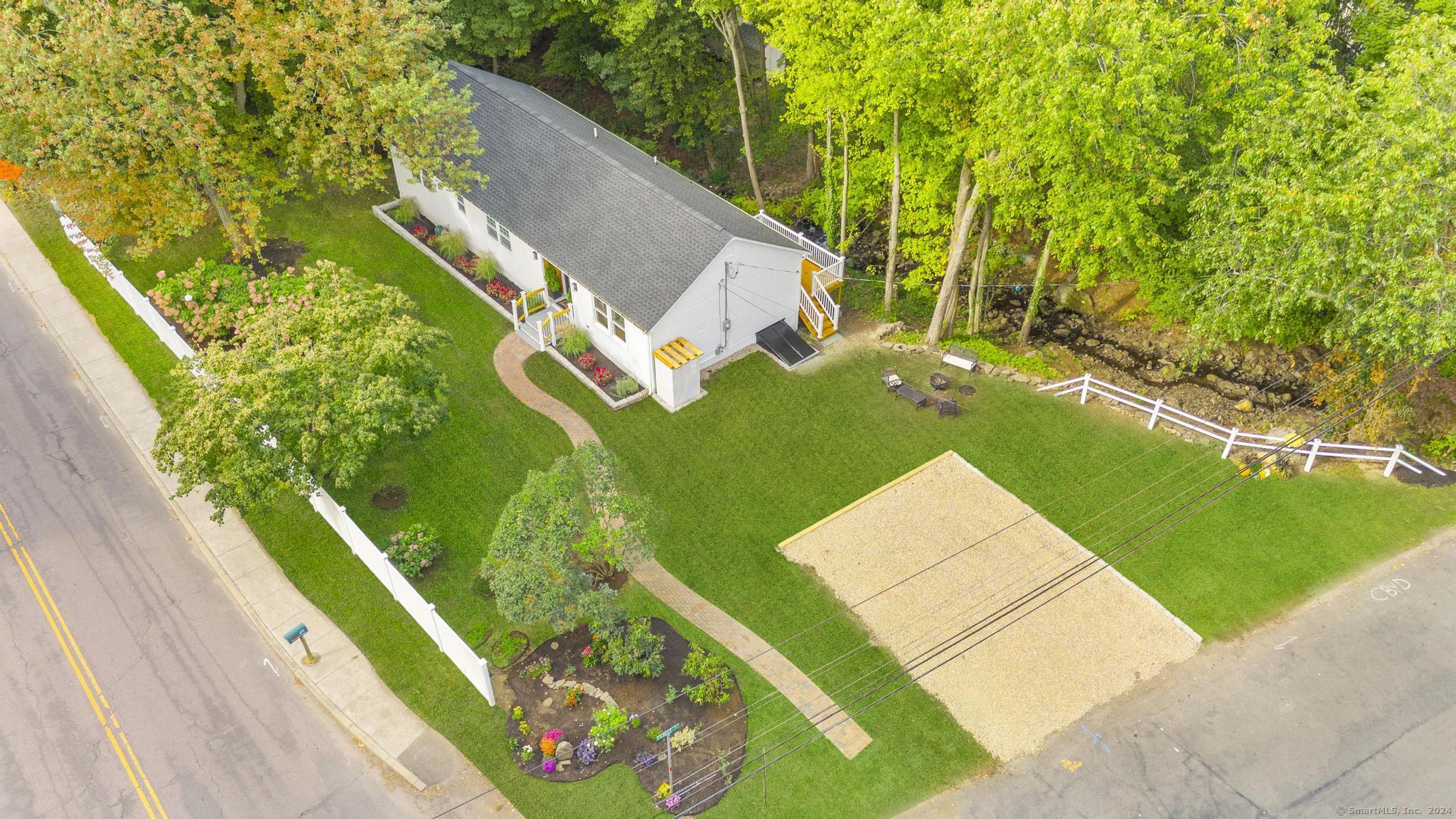 451 Burroughs Road Fairfield, CT 06825 - Photo 1 of 1 a view of a backyard