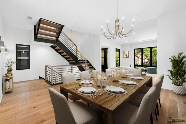 a view of a dining room with furniture wooden floor and chandelier