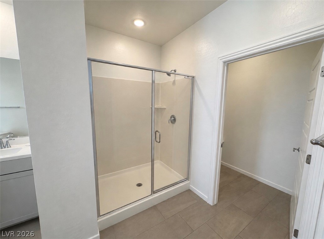 2555 Hampton Road, Unit 4205 Henderson, NV 89052 - Photo 26 of 52 This bathroom features a contemporary shower and modern vanity, offering a sleek and inviting space.