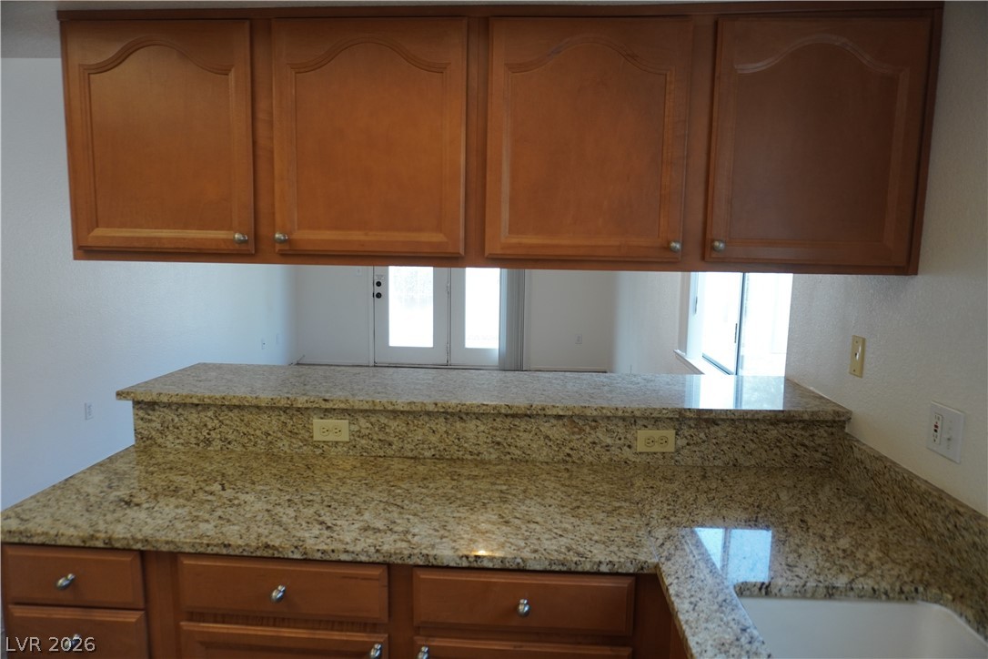 8328 Del Rey Avenue Las Vegas, NV 89117 - Photo 15 of 38 Prepare meals on abundant granite countertops, perfect for entertaining.