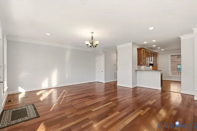 a view of kitchen with cabinets and wooden floor
