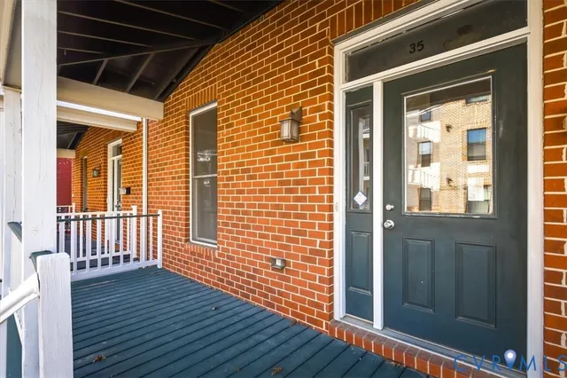 a view of porch with wooden floor