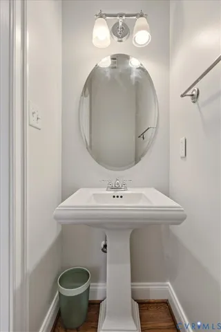 a bathroom with a sink and mirror