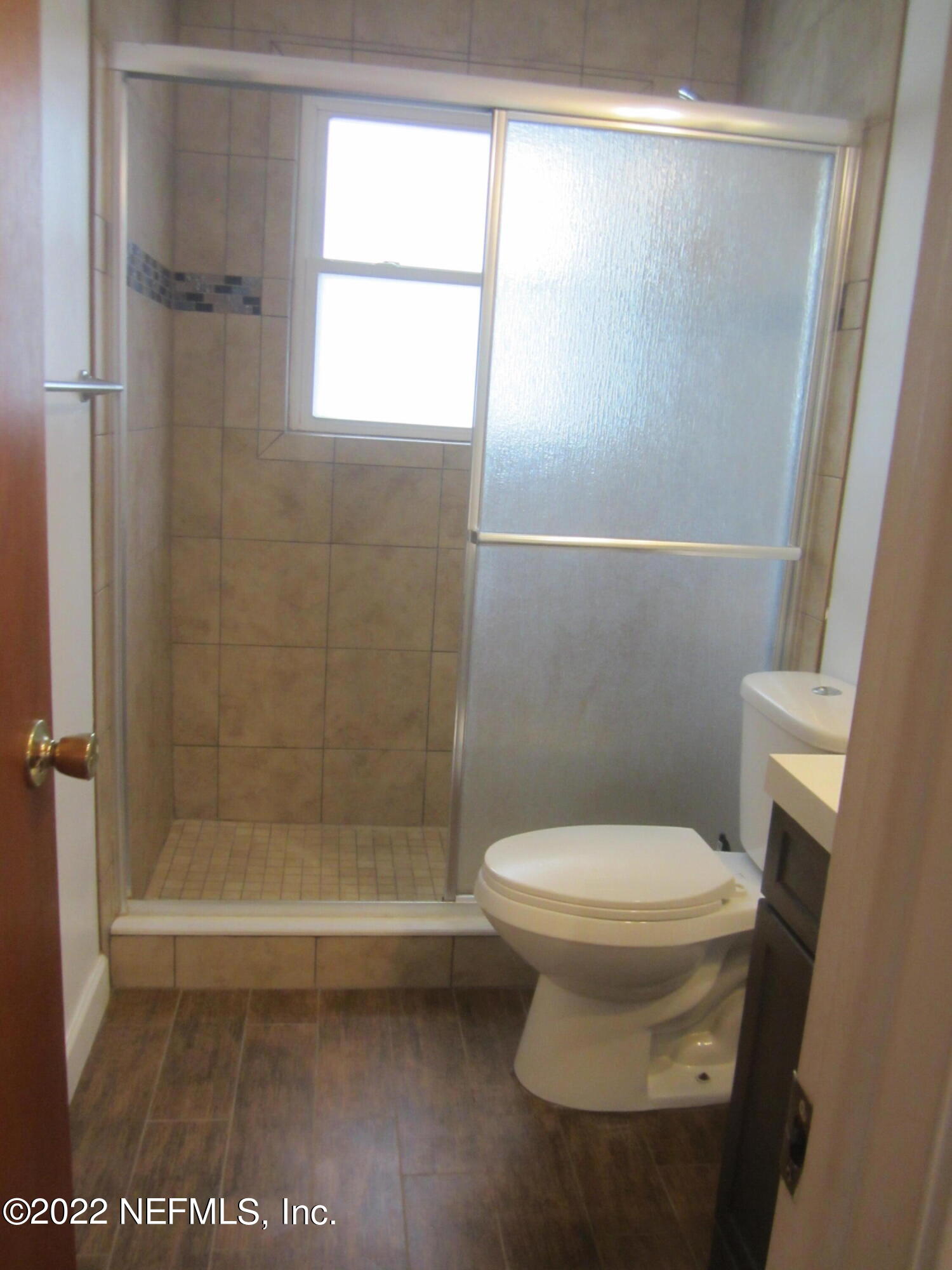 13005 Mandarin Road Jacksonville, FL 32223 - Photo 31 of 51 a bathroom with a toilet and a shower