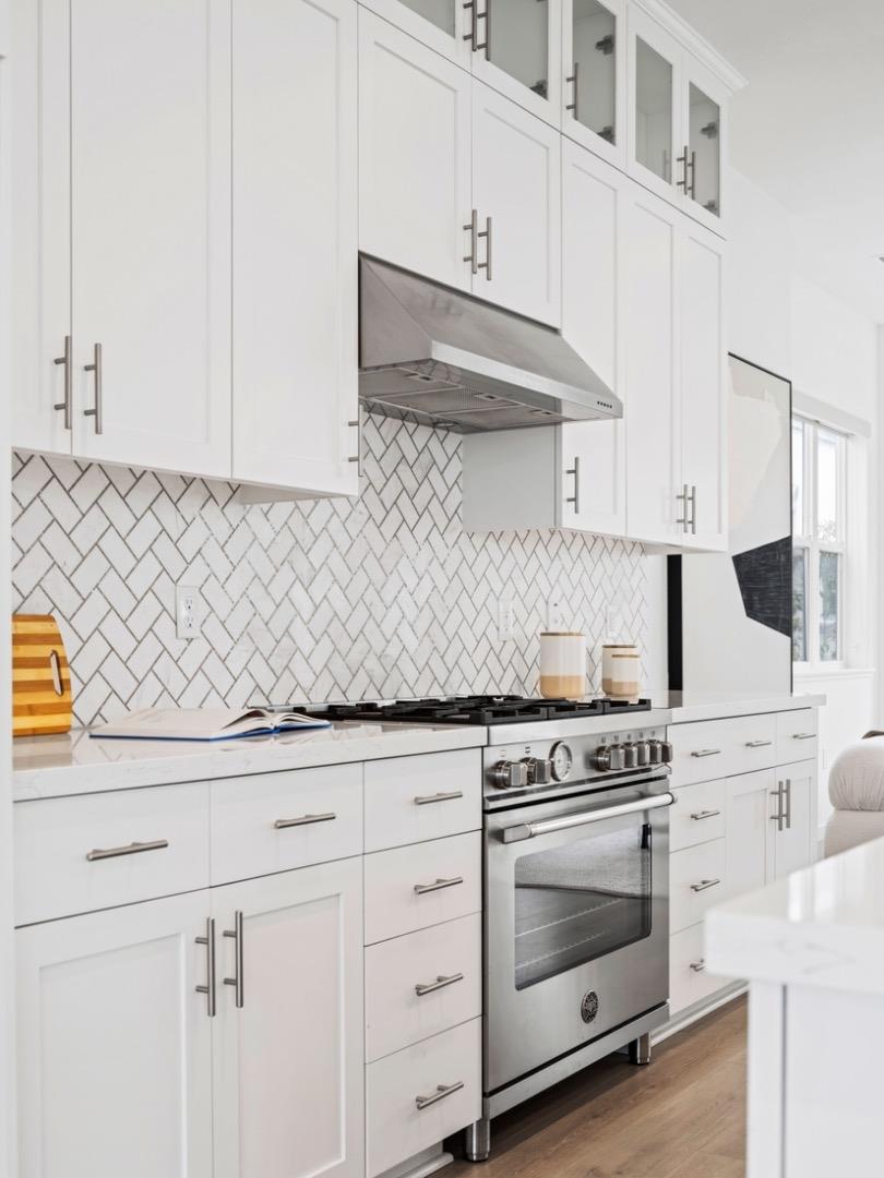 2149 Pastoral Loop San Jose, CA 95122 - Photo 17 of 46 a kitchen with white cabinets and appliances