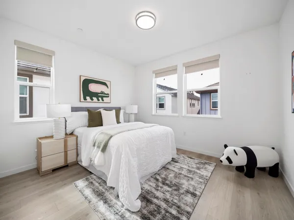 a bedroom with a bed and a couch