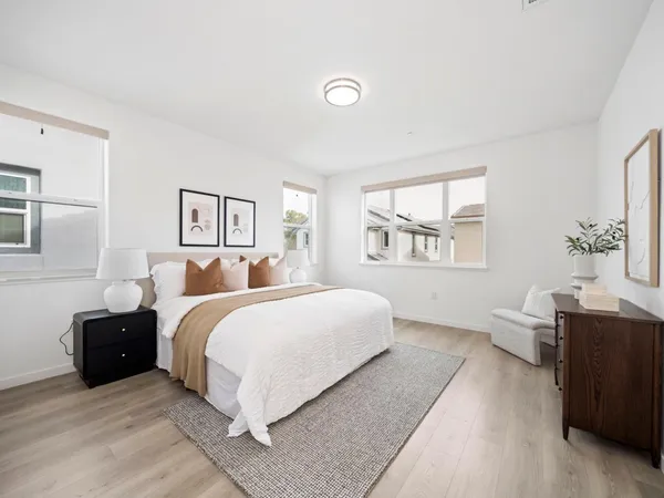 a bed room with bed and window