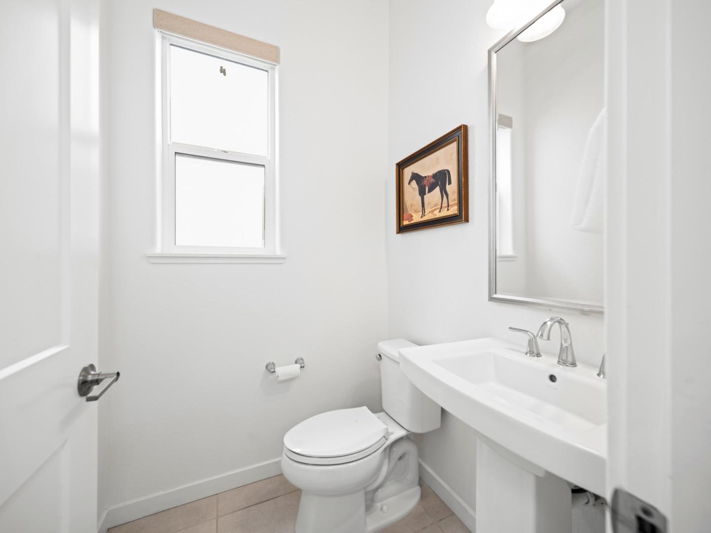 2149 Pastoral Loop San Jose, CA 95122 - Photo 25 of 46 a bathroom with a toilet sink and mirror