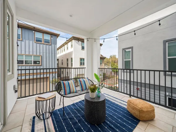 a view of a balcony with wooden floor