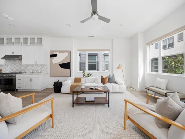 a living room with furniture and windows