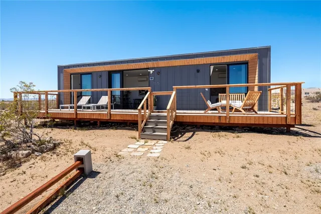 a backyard of a house with barbeque oven