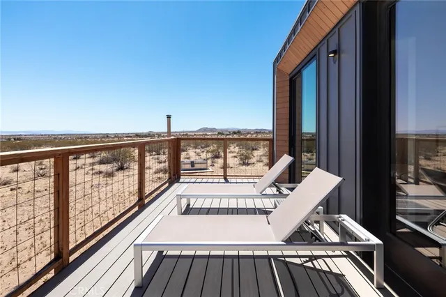 a view of balcony with wooden floor