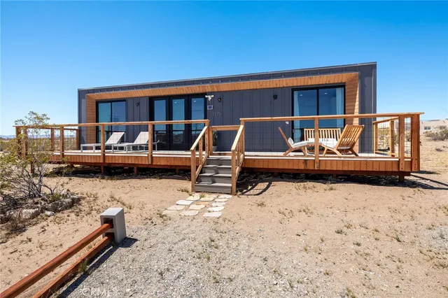 a backyard of a house with barbeque oven