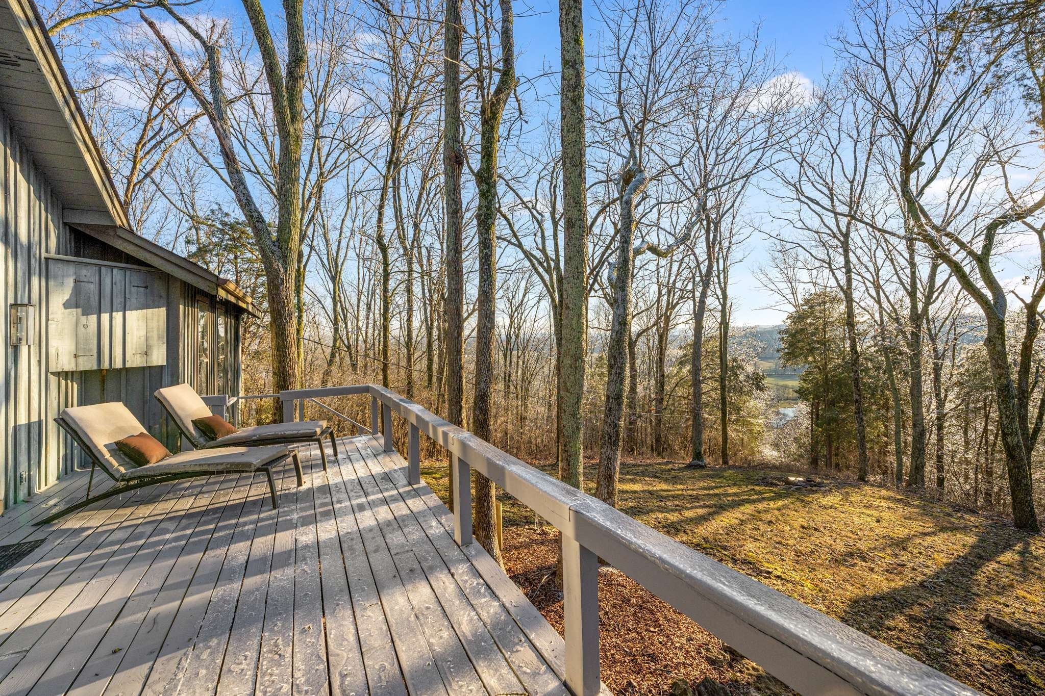 360 Vaughn Road Nashville, TN 37221 - Photo 1 of 34 a view of a balcony with chairs and wooden fence