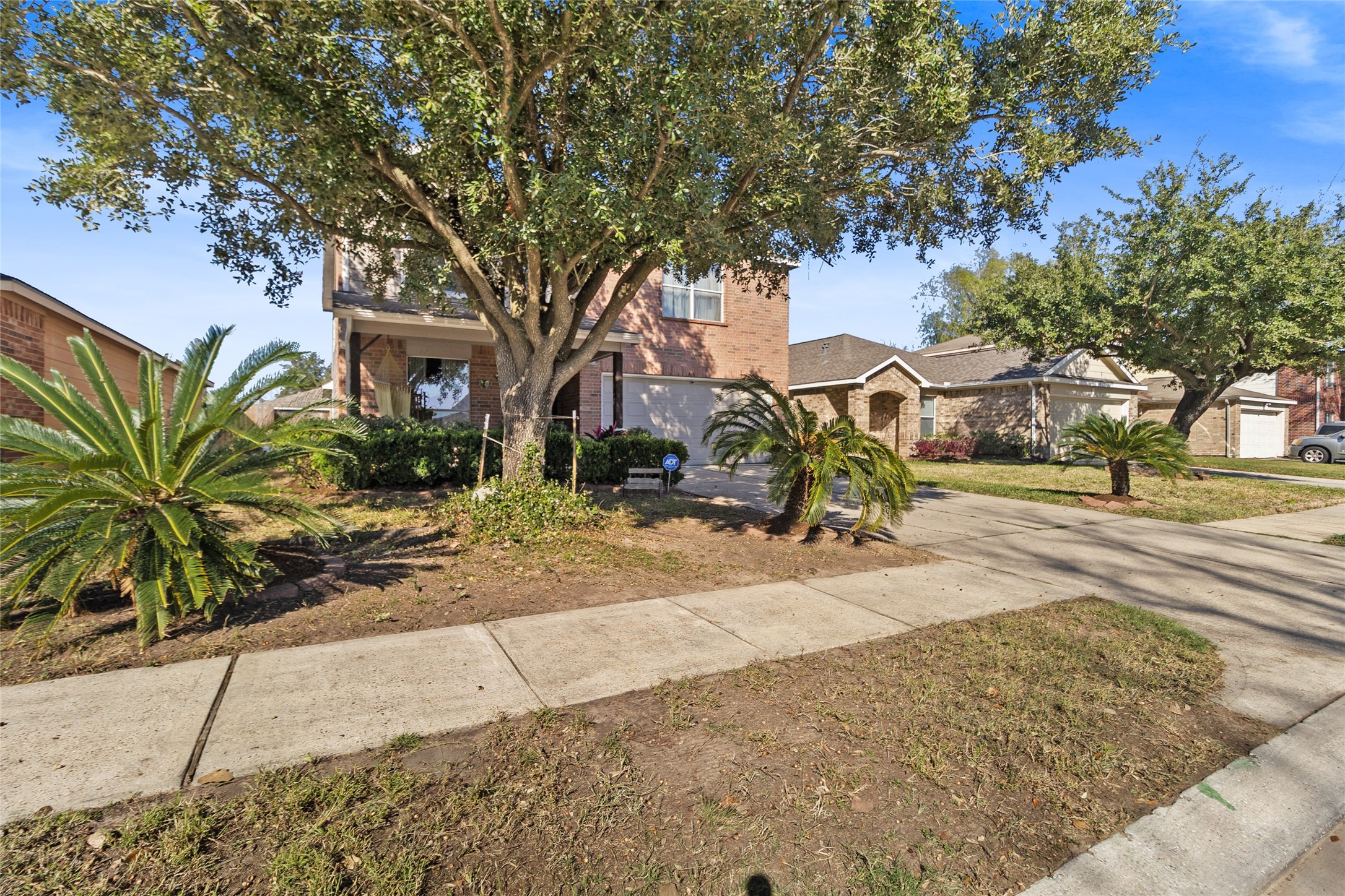615 Ashlen Drive Houston, TX 77073 - Photo 34 of 35 Standing back, your home sits comfortably along a quiet neighborhood street with established landscaping and mature trees all around. The front yard feels open and relaxed, giving you space to enjoy the outdoors while still feeling nicely tucked into the neighborhood.