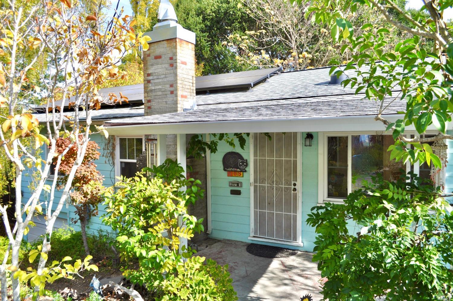 front view of a house with a small yard