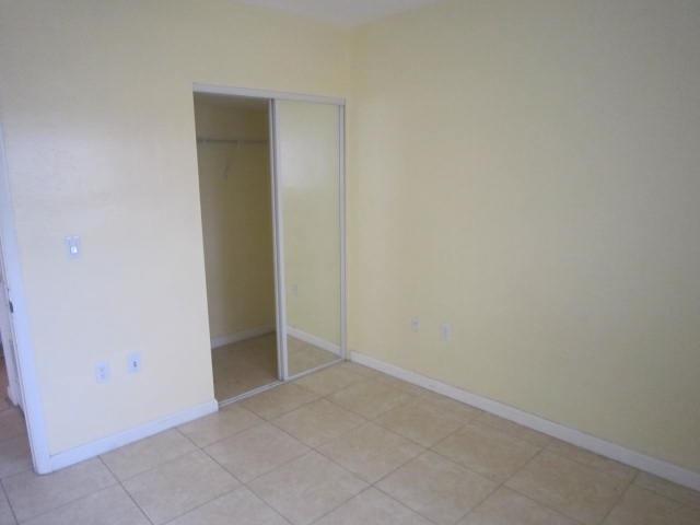 341 Shady Lane Road Palm Springs, FL 33461 - Photo 18 of 24 a view of an empty room
