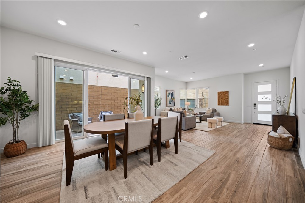 116 Newall Irvine, CA 92618 - Photo 14 of 45 a view of a dining room with furniture window and wooden floor