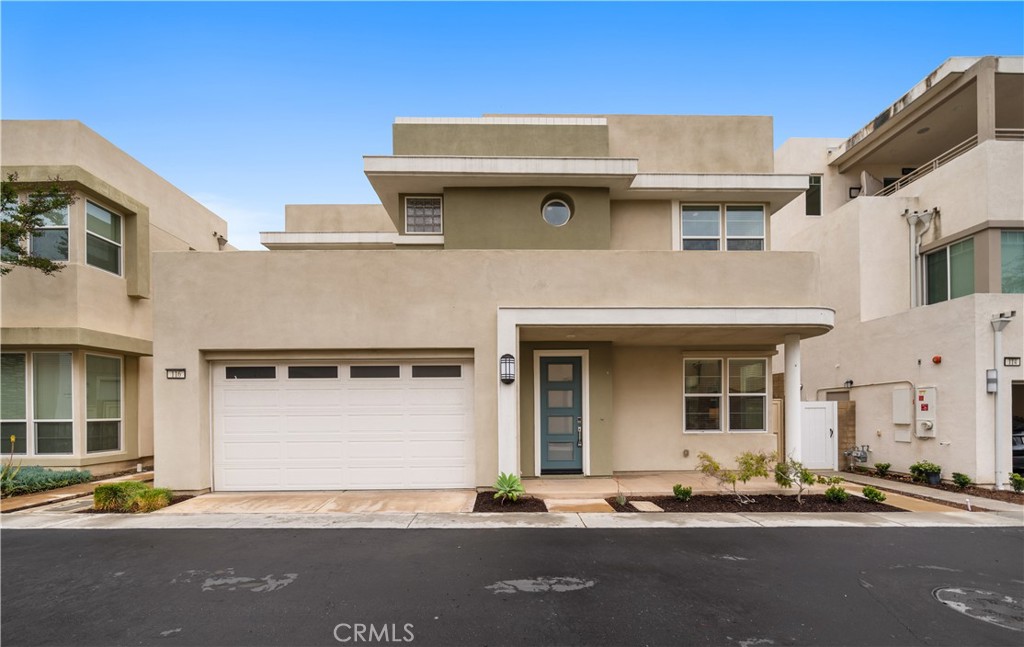 116 Newall Irvine, CA 92618 - Photo 2 of 45 a front view of a house with a road