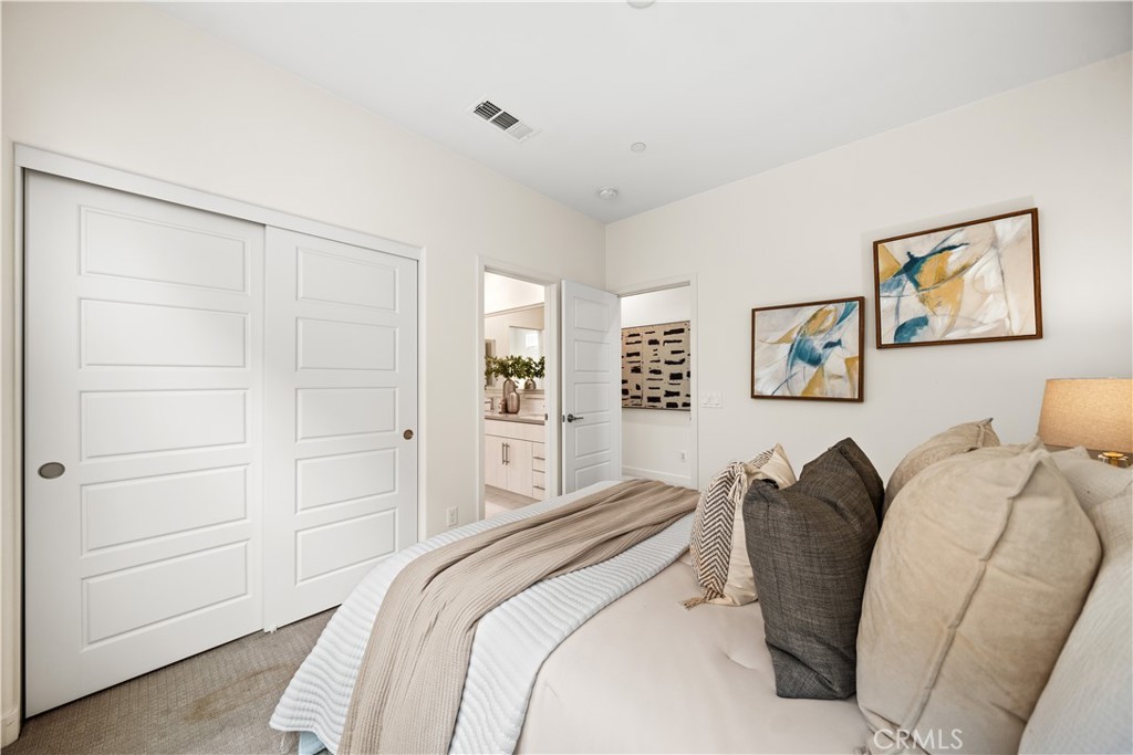 116 Newall Irvine, CA 92618 - Photo 21 of 45 a bedroom with a bed and a painting on the wall