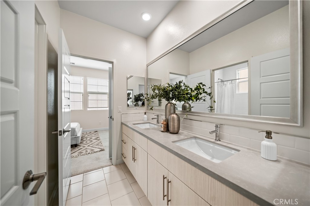116 Newall Irvine, CA 92618 - Photo 22 of 45 a bathroom with a sink and a mirror