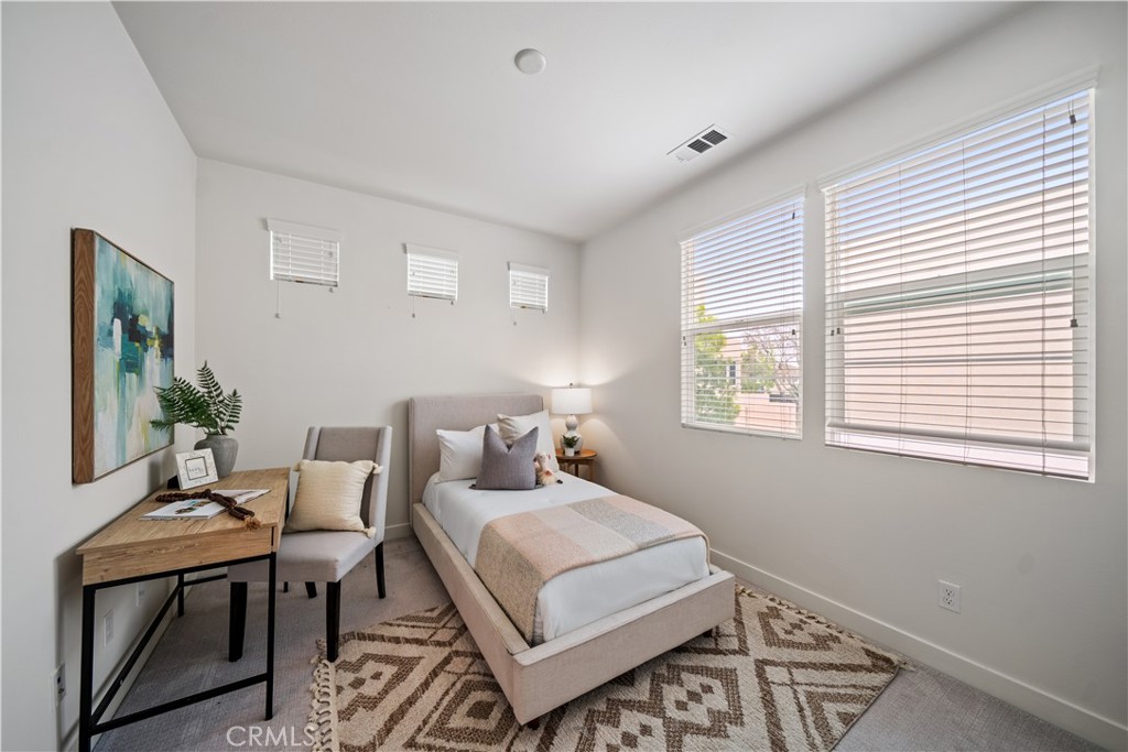 116 Newall Irvine, CA 92618 - Photo 25 of 45 a bedroom with a bed and a window