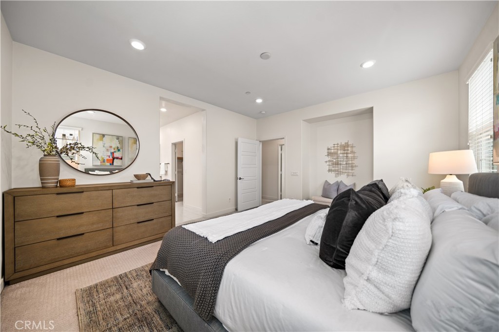 116 Newall Irvine, CA 92618 - Photo 29 of 45 a bedroom with a bed and a dresser
